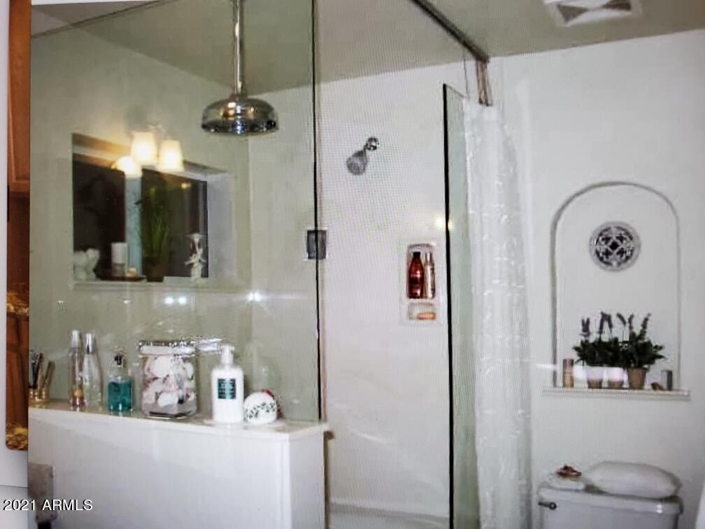 6017 East Rancho Del Oro Drive Cave Creek, AZ 85331 - Photo 15 of 28 a bathroom with a sink and a mirror
