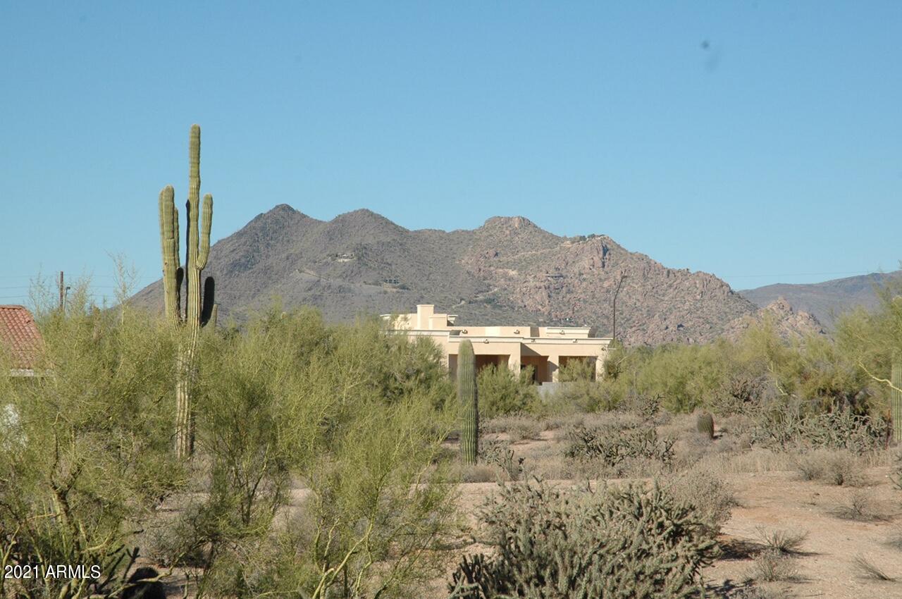 6017 East Rancho Del Oro Drive Cave Creek, AZ 85331 - Photo 6 of 28 a view of a house with a mountain and a forest