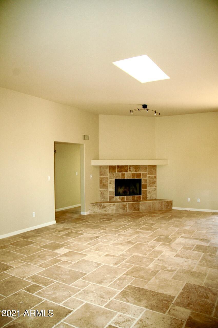6017 East Rancho Del Oro Drive Cave Creek, AZ 85331 - Photo 7 of 28 a view of empty room with a fireplace