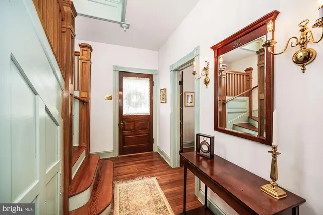 a kitchen with stainless steel appliances a stove a sink and a refrigerator