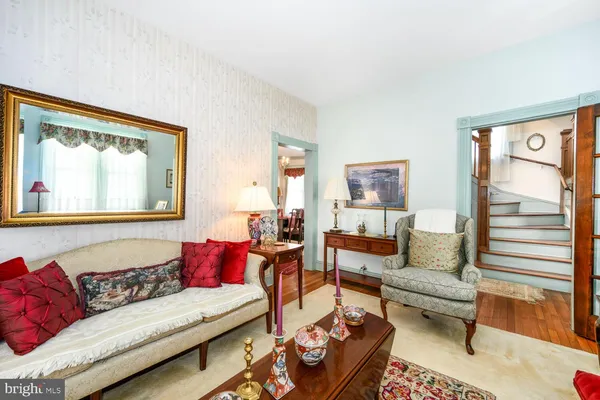 a view of a room with furniture and windows