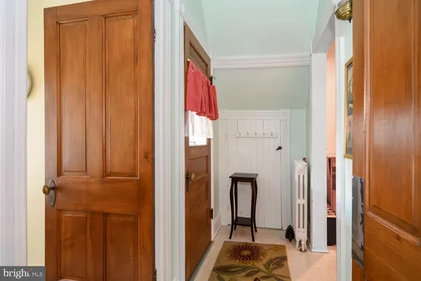 a spacious bedroom with a bed and a chandelier
