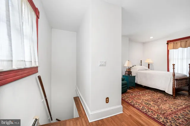 a picture of a bench in front of a wall