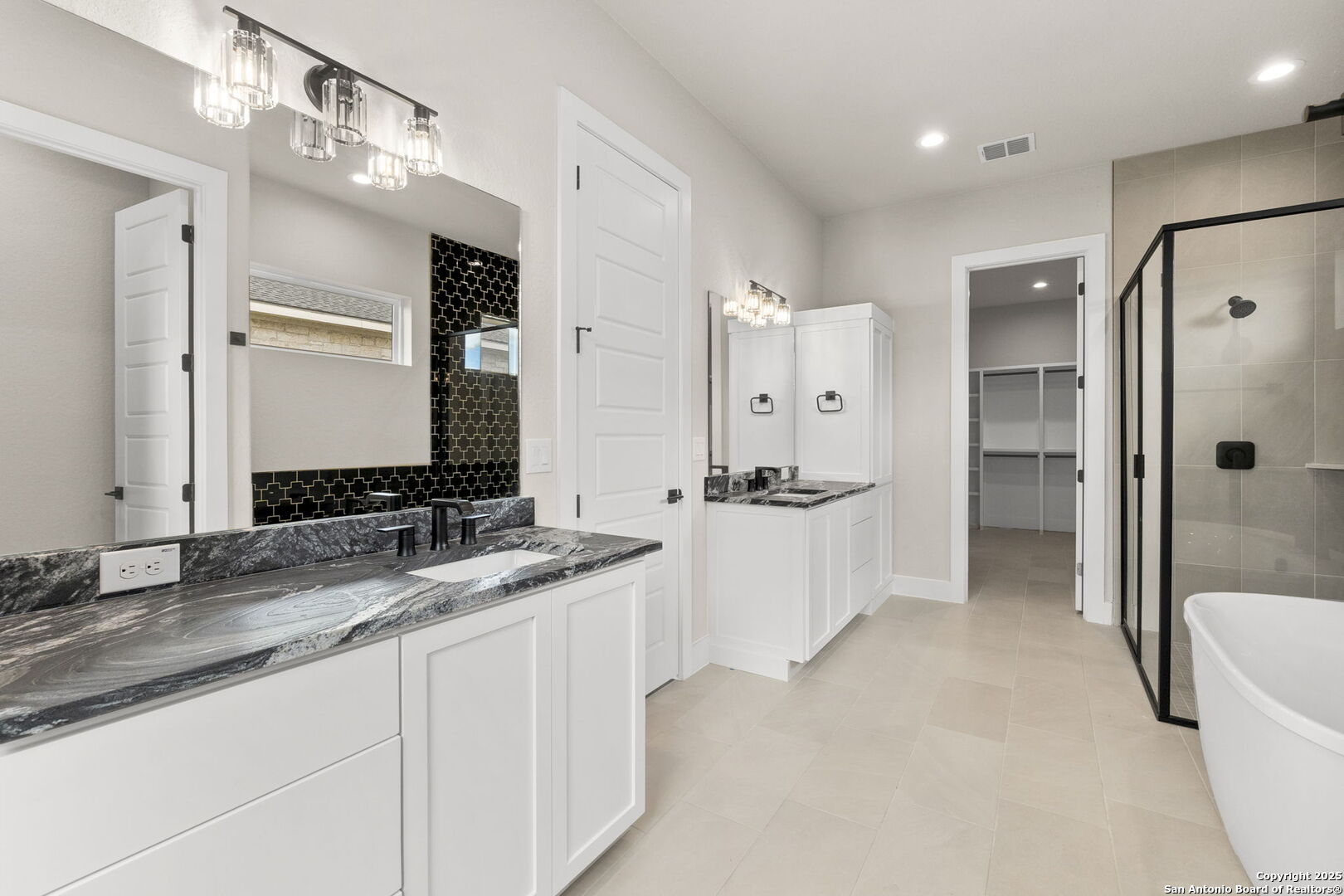 31 Peace Pipe Wimberley, TX 78676 - Photo 11 of 11 a spacious bathroom with a granite countertop sink mirror and a bathtub