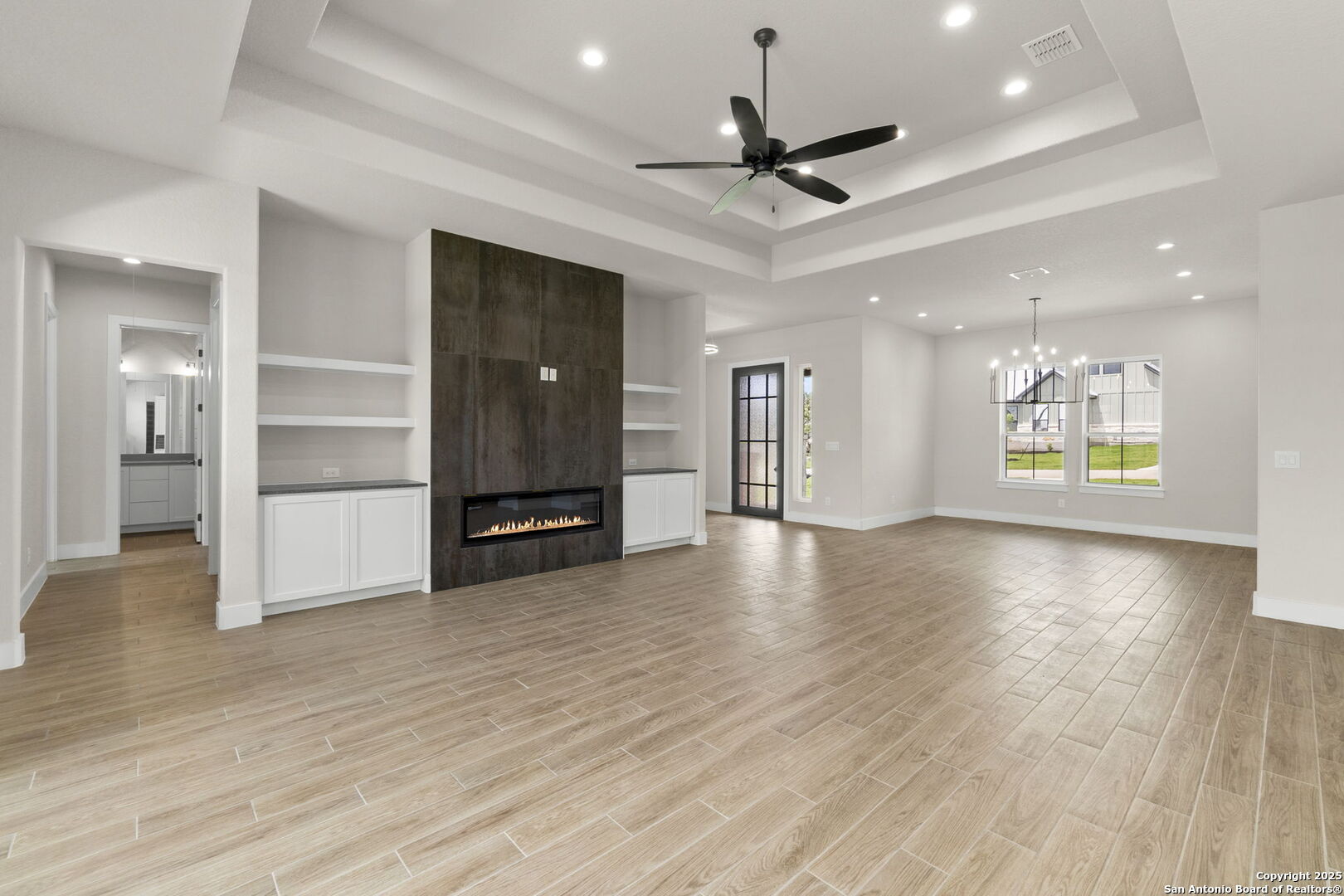 31 Peace Pipe Wimberley, TX 78676 - Photo 7 of 11 a view of an empty room with a window and wooden floor