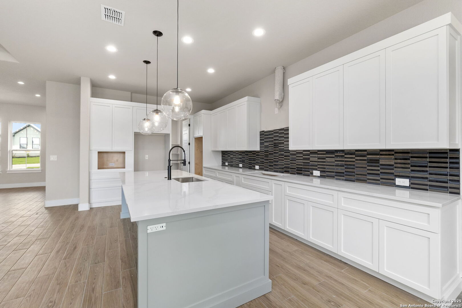 31 Peace Pipe Wimberley, TX 78676 - Photo 9 of 11 a kitchen with kitchen island a sink stainless steel appliances and cabinets