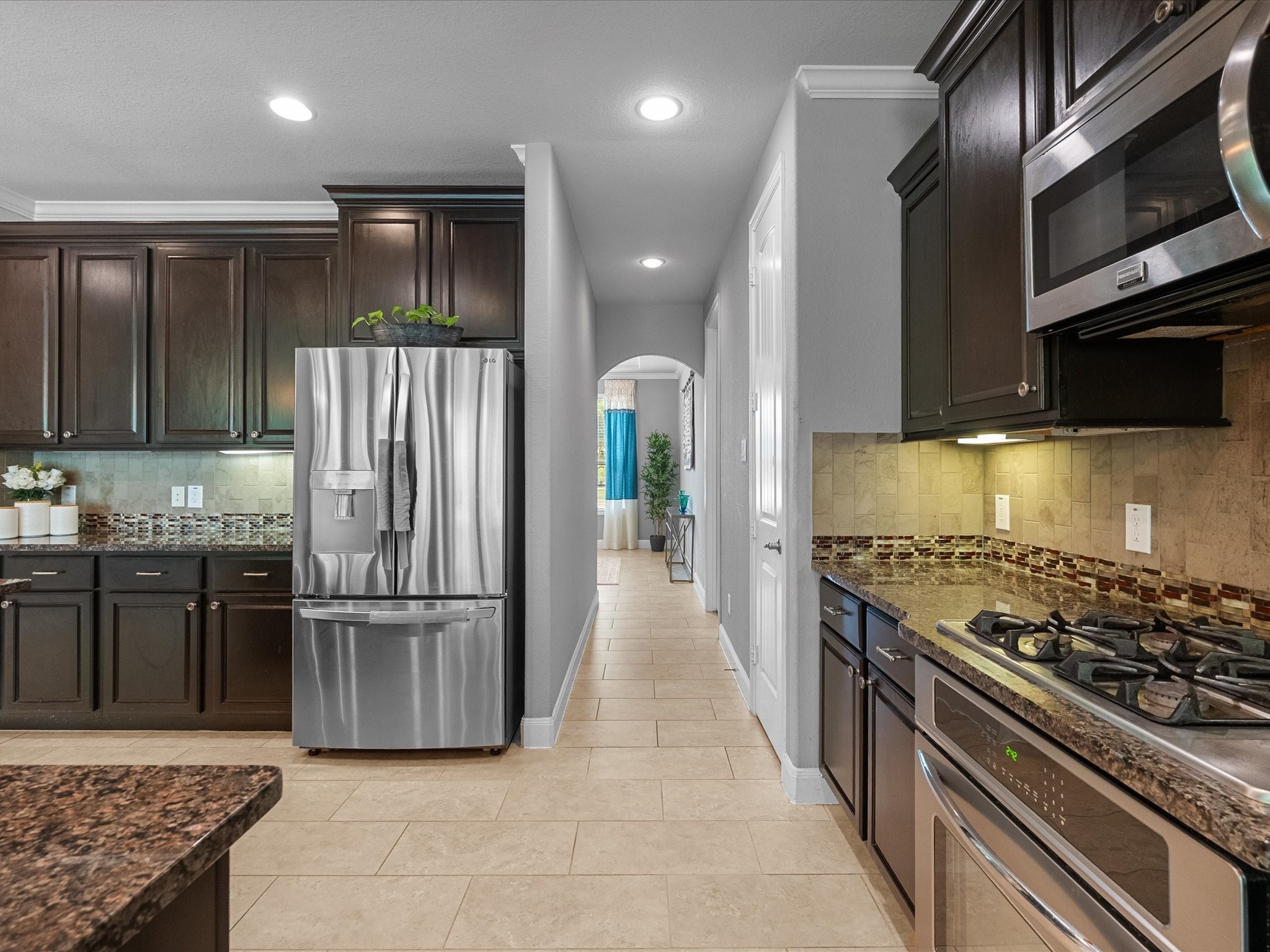 5323 Savannah Bend Lane Rosharon, TX 77583 - Photo 11 of 46 a kitchen with stainless steel appliances granite countertop a stove and a refrigerator