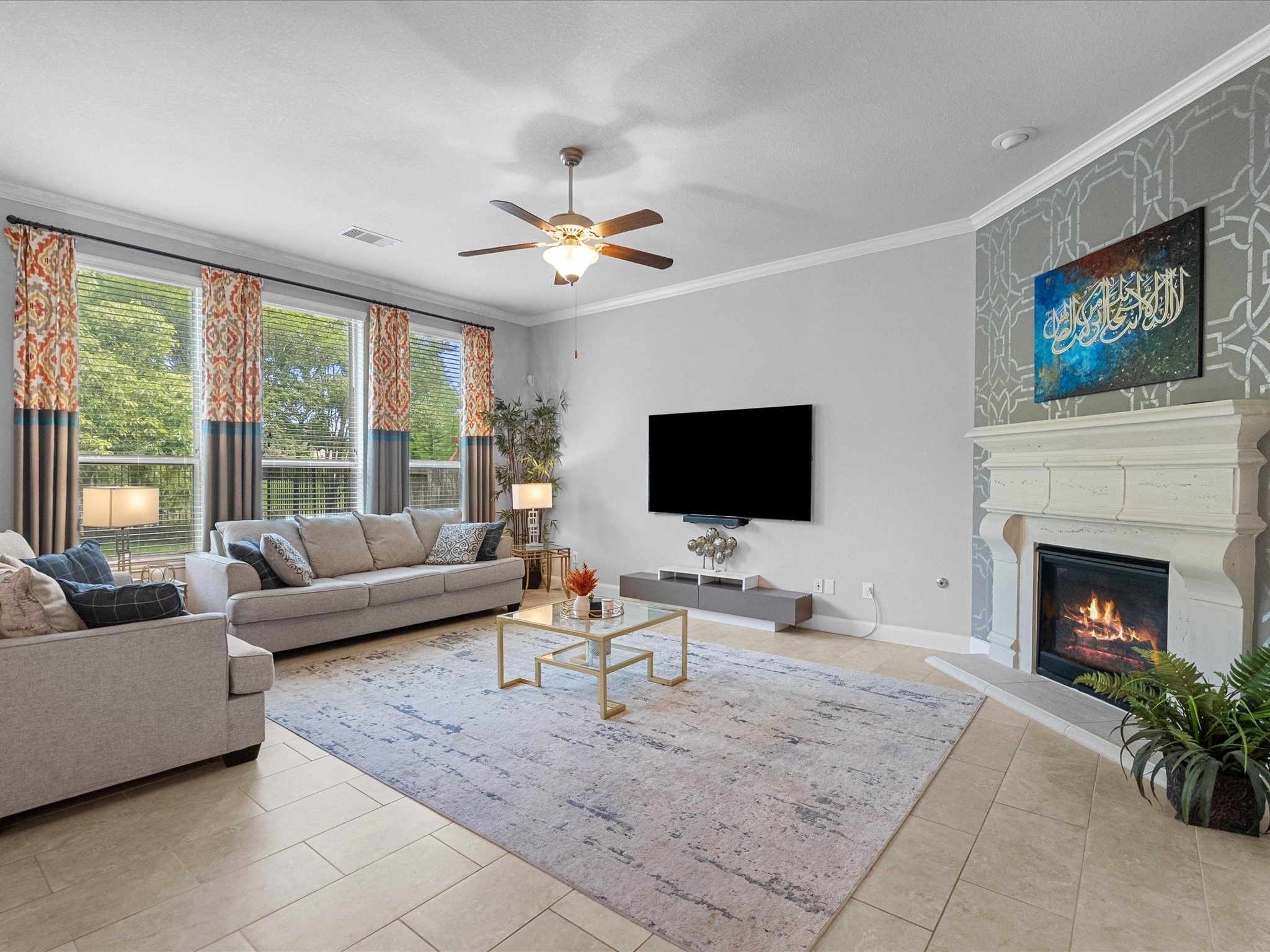 5323 Savannah Bend Lane Rosharon, TX 77583 - Photo 12 of 46 a living room with furniture a fireplace and a flat screen tv