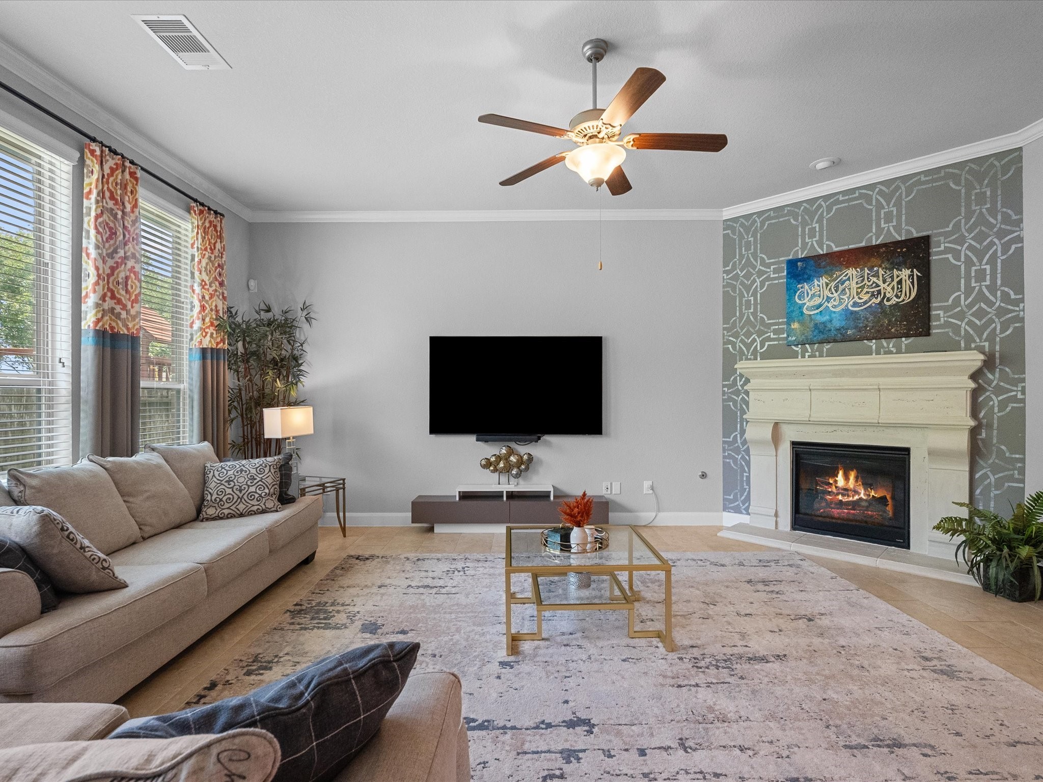 5323 Savannah Bend Lane Rosharon, TX 77583 - Photo 14 of 46 a living room with furniture a flat screen tv and a fireplace