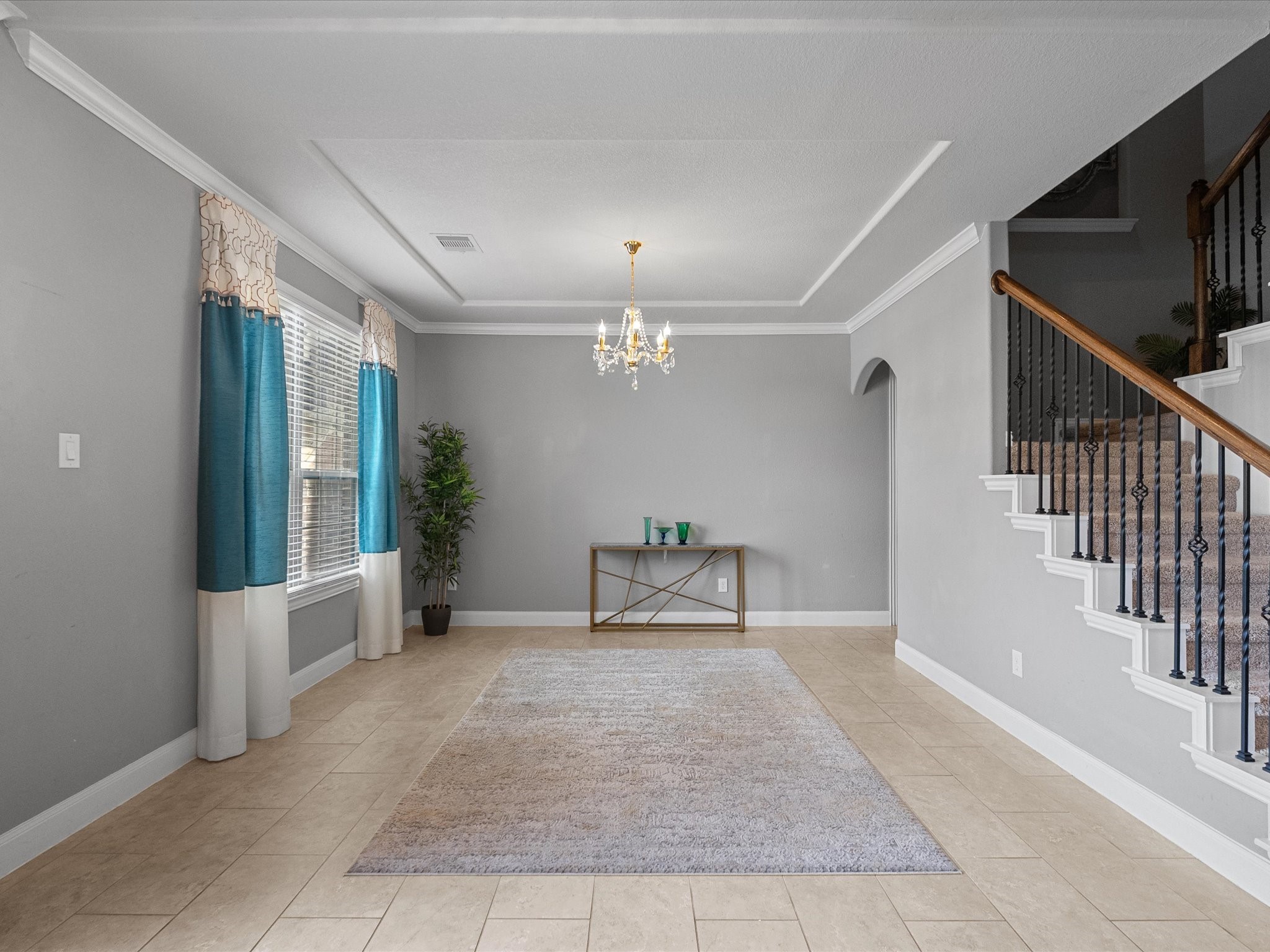 5323 Savannah Bend Lane Rosharon, TX 77583 - Photo 20 of 46 a view of an empty room with stairs and a floor to ceiling window