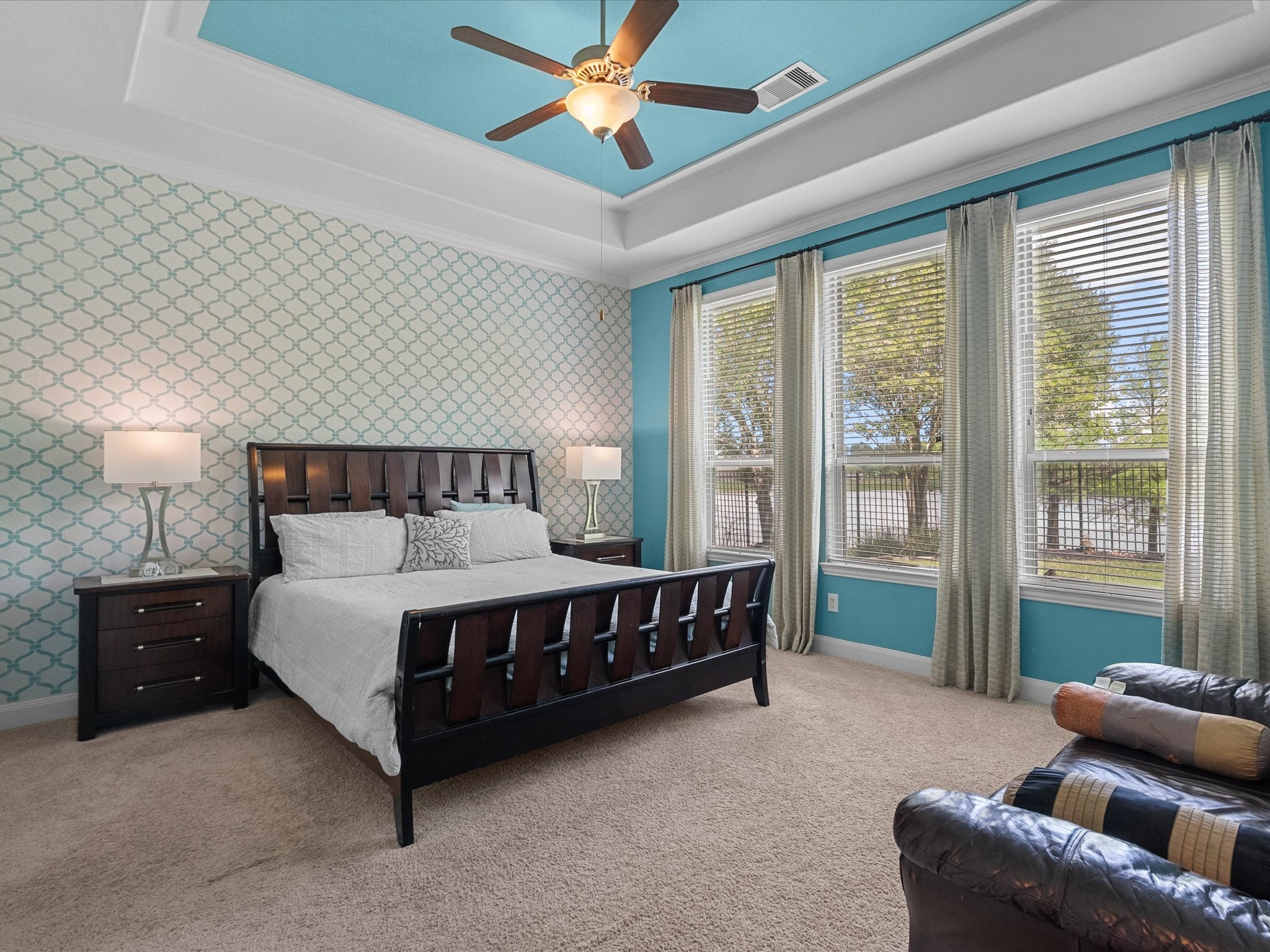 5323 Savannah Bend Lane Rosharon, TX 77583 - Photo 25 of 46 a spacious bedroom with a bed and a chandelier