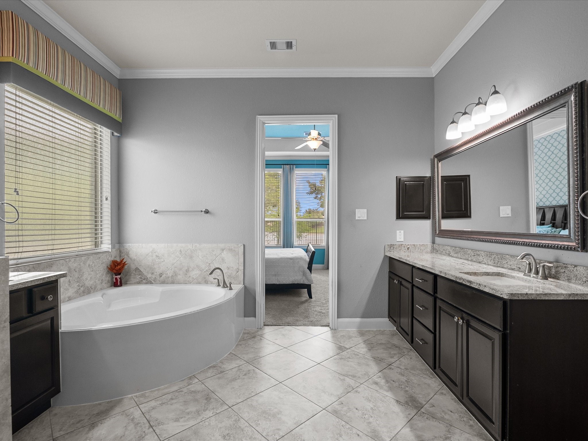 5323 Savannah Bend Lane Rosharon, TX 77583 - Photo 26 of 46 a spacious bathroom with a tub double sink and mirror