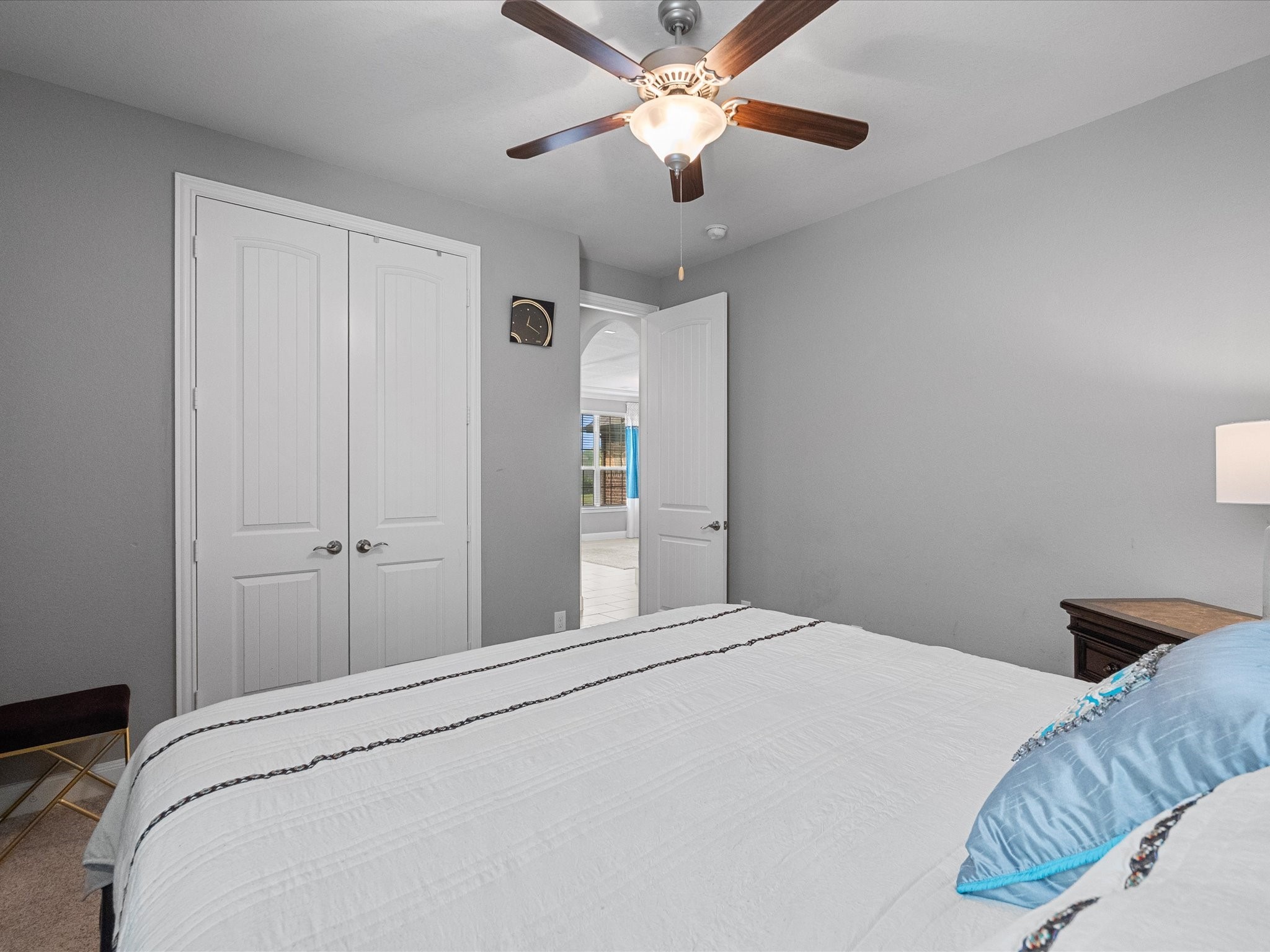 5323 Savannah Bend Lane Rosharon, TX 77583 - Photo 30 of 46 a bedroom with a large bed and a chandelier