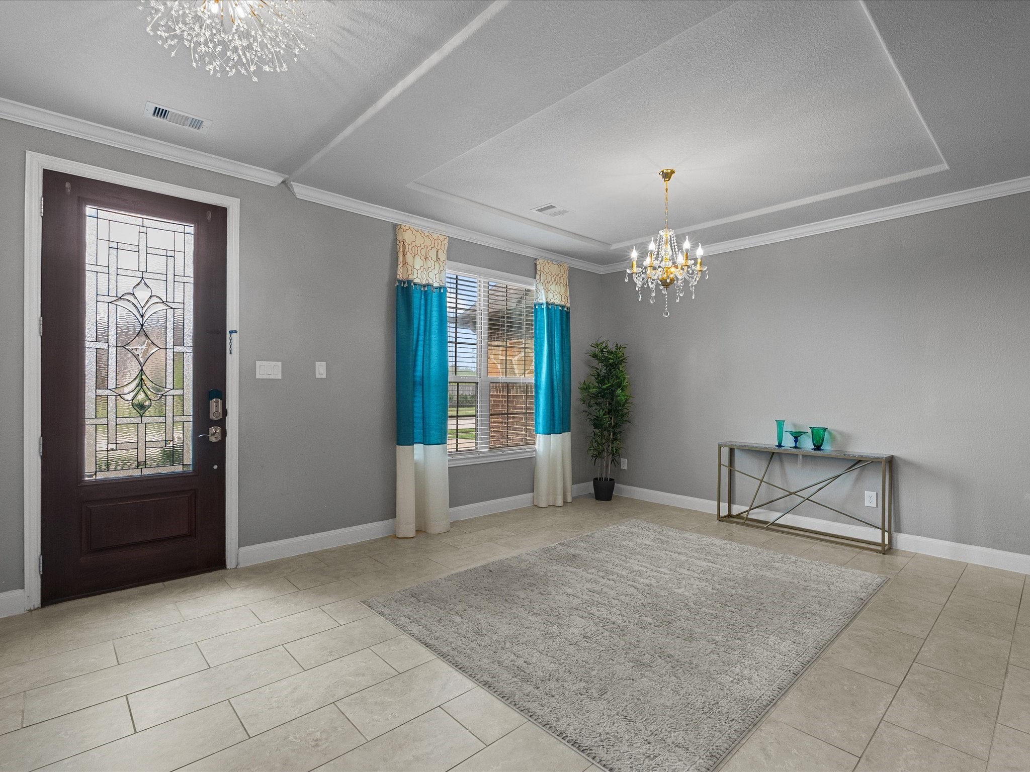 5323 Savannah Bend Lane Rosharon, TX 77583 - Photo 4 of 46 a living room with furniture and a chandelier