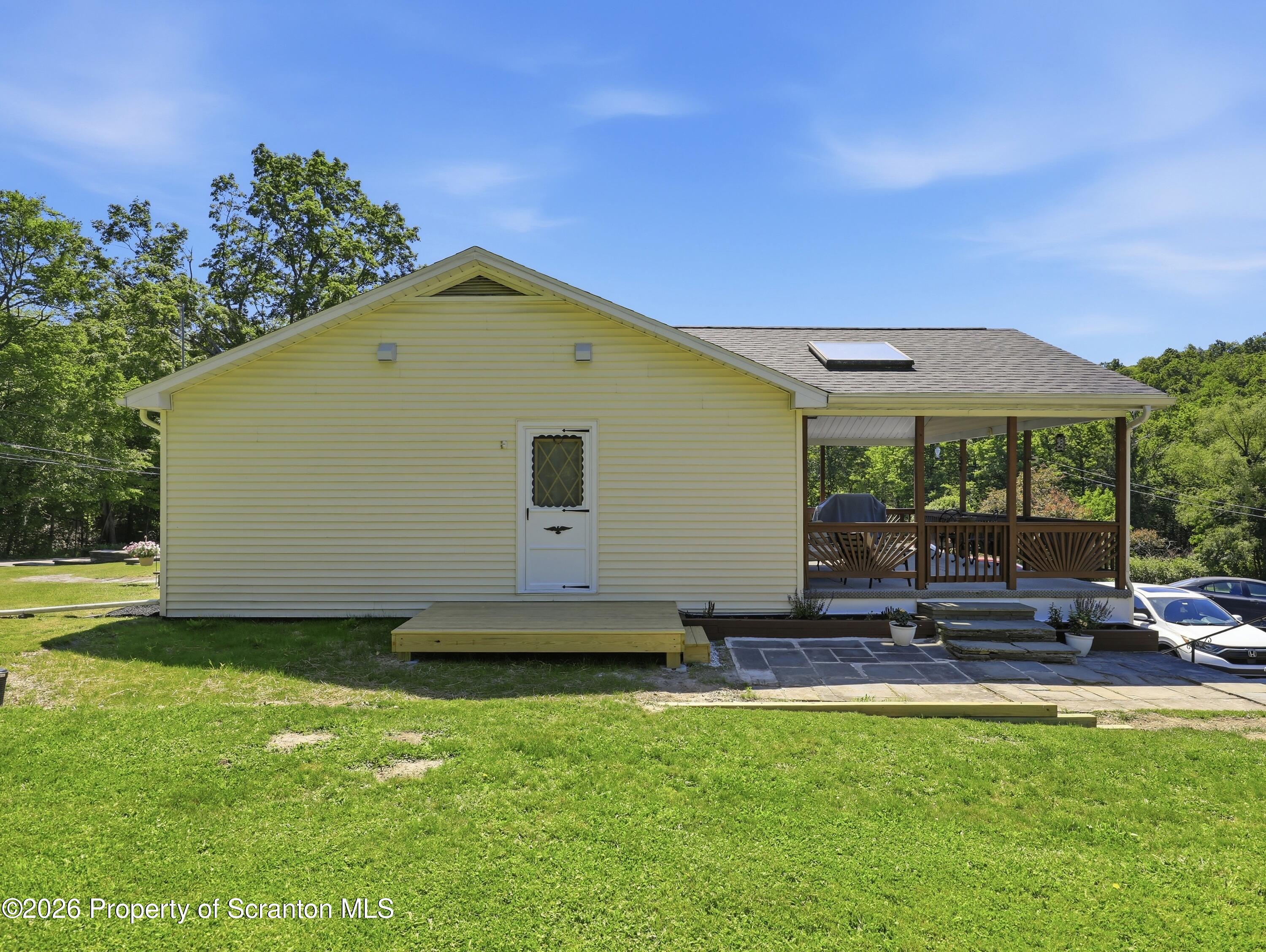 1237 Heart Lake Road Scott Township, PA 18433 - Photo 29 of 39 a front view of a house with a yard