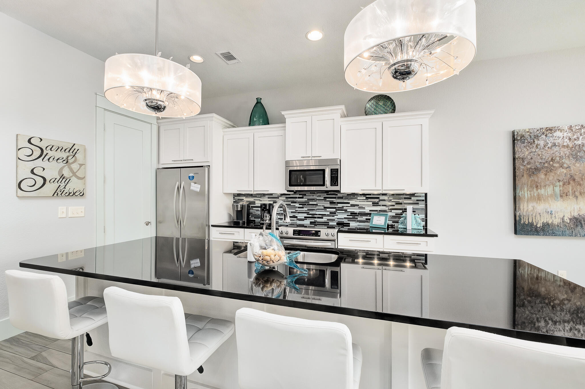 1959 Baytowne Loop Miramar Beach, FL 32550 - Photo 11 of 33 a kitchen with stainless steel appliances granite countertop a sink a stove and refrigerator