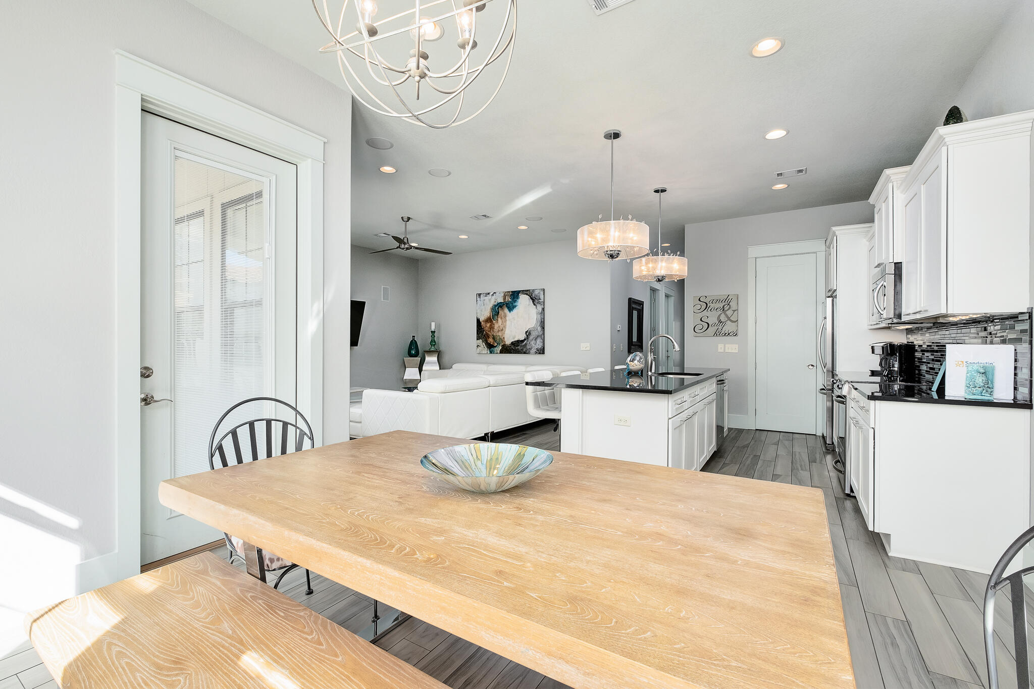 1959 Baytowne Loop Miramar Beach, FL 32550 - Photo 12 of 33 a bedroom with a bed and a chandelier