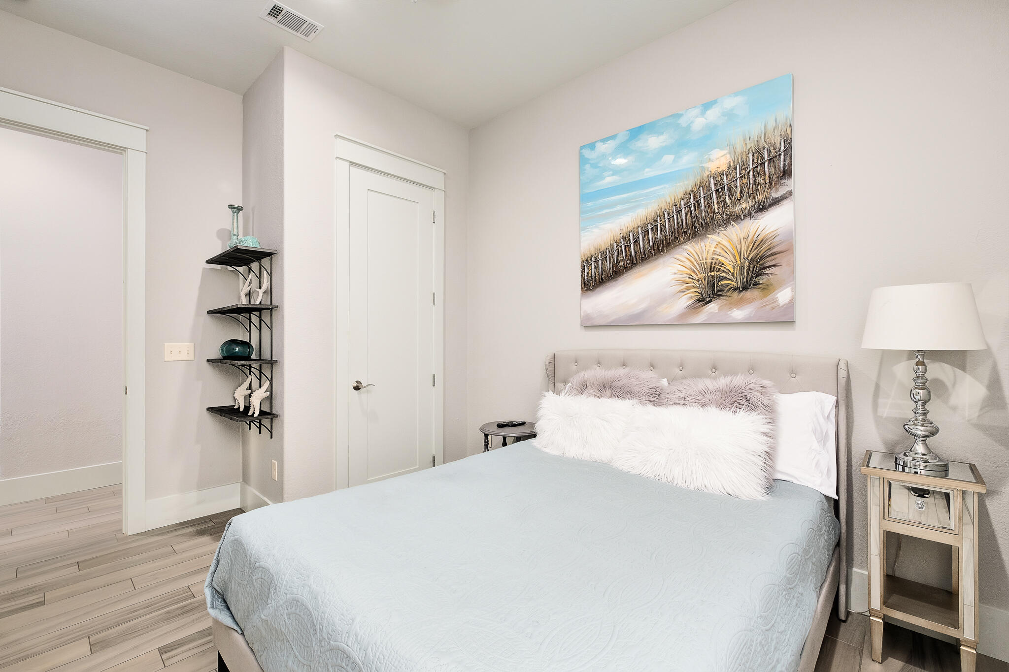 1959 Baytowne Loop Miramar Beach, FL 32550 - Photo 23 of 33 a bedroom with a bed and a lamp on the dresser