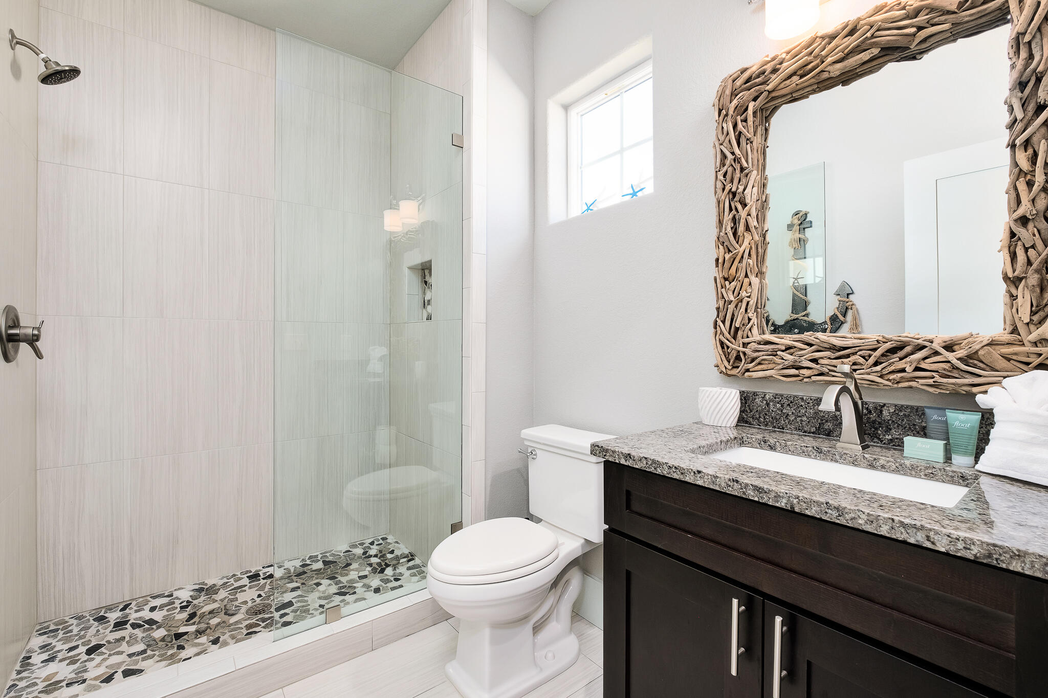 1959 Baytowne Loop Miramar Beach, FL 32550 - Photo 30 of 33 a bathroom with a granite countertop sink toilet a mirror and shower