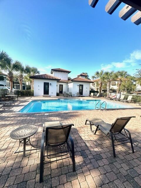 1959 Baytowne Loop Miramar Beach, FL 32550 - Photo 33 of 33 a swimming pool with outdoor seating and yard