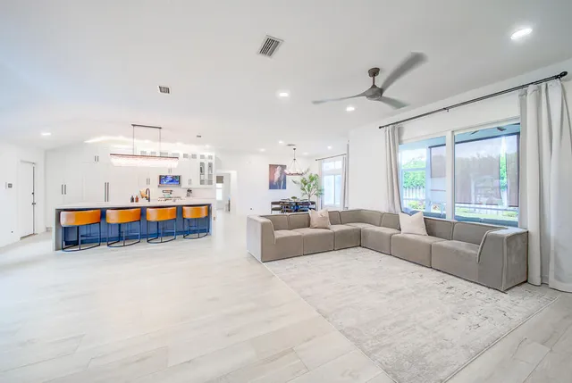 a living room with furniture and windows