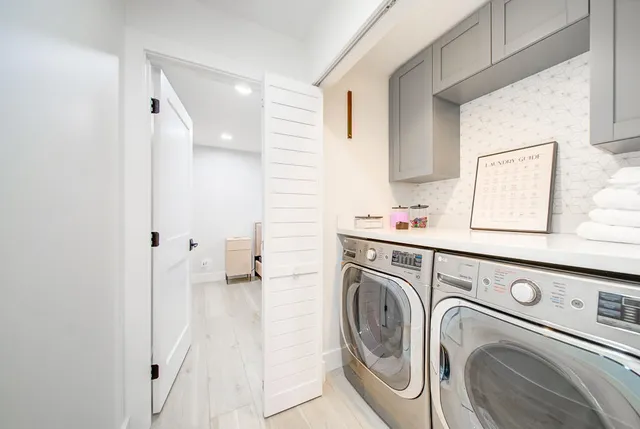 a utility room with dryer and washer