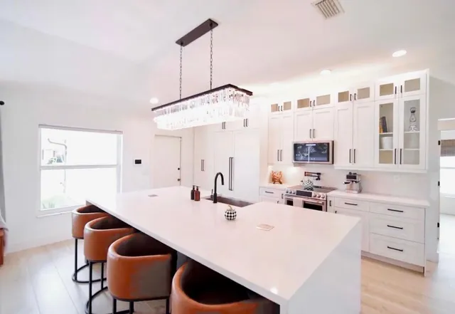 a view of kitchen island with furniture and wooden floor