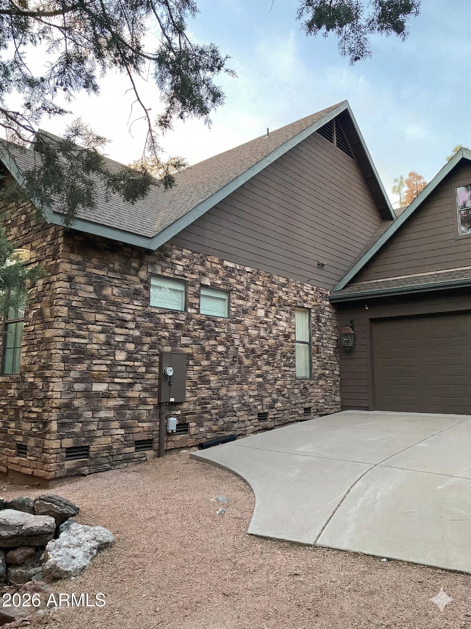 243 Oak Drive Payson, AZ 85541 - Photo 1 of 24 a view of yellow house with a yard