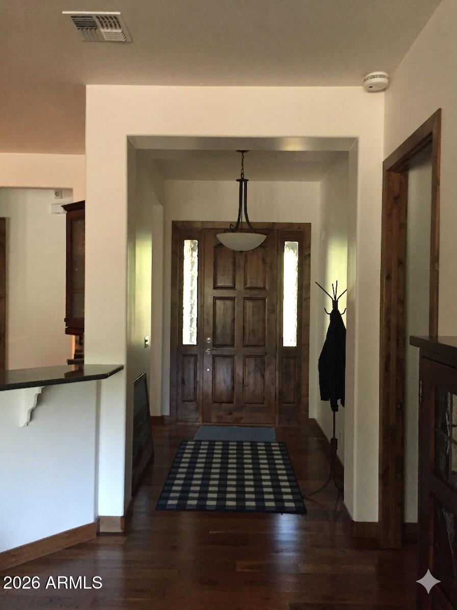 243 Oak Drive Payson, AZ 85541 - Photo 13 of 24 a view of a hallway with wooden floor and staircase