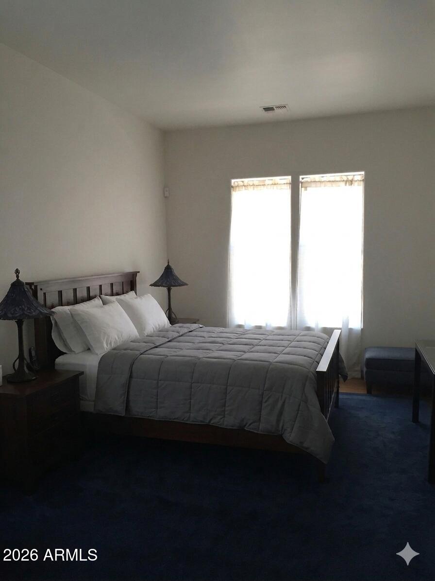 243 Oak Drive Payson, AZ 85541 - Photo 15 of 24 a bedroom with a bed and wooden floor