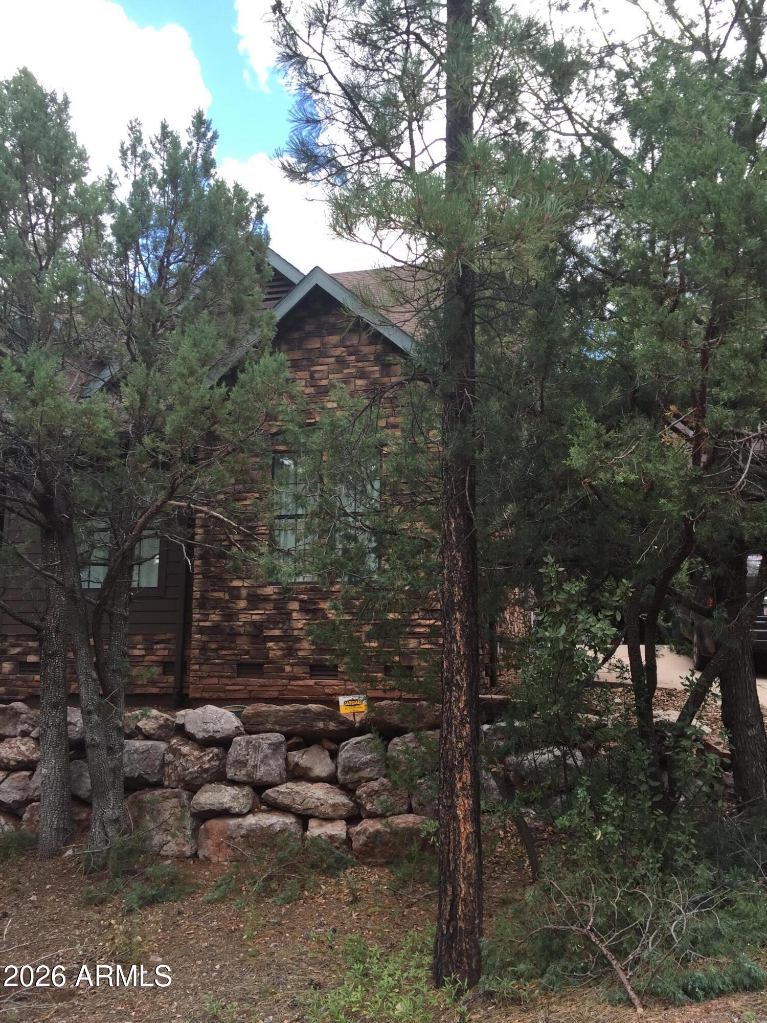 243 Oak Drive Payson, AZ 85541 - Photo 2 of 24 a backyard of a house with lots of green space