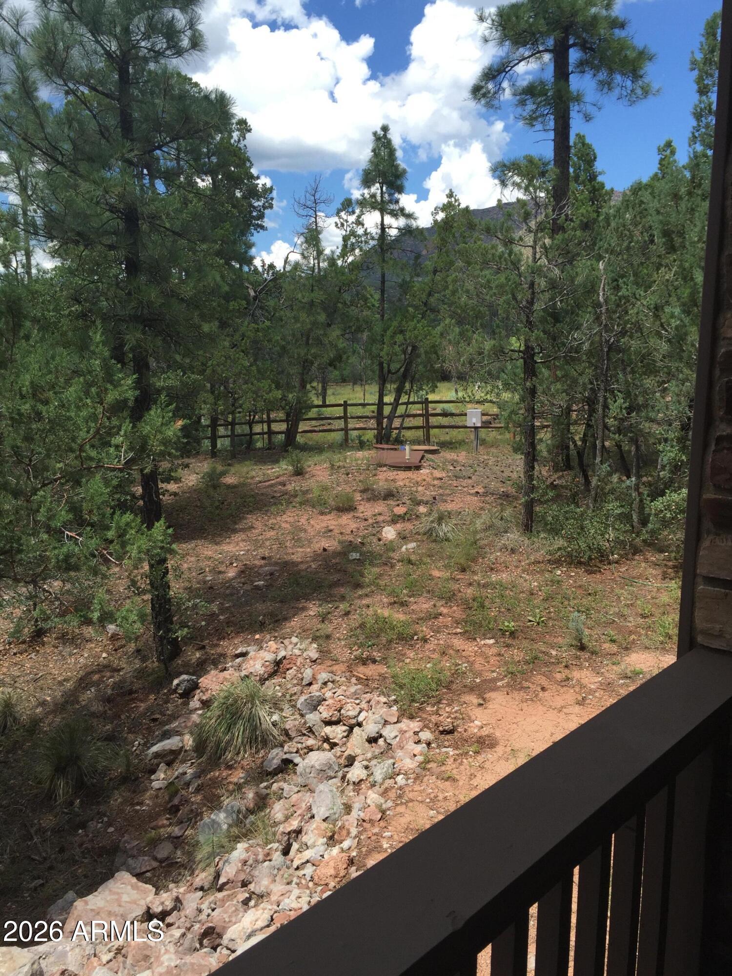 243 Oak Drive Payson, AZ 85541 - Photo 7 of 24 a view of a yard with wooden fence