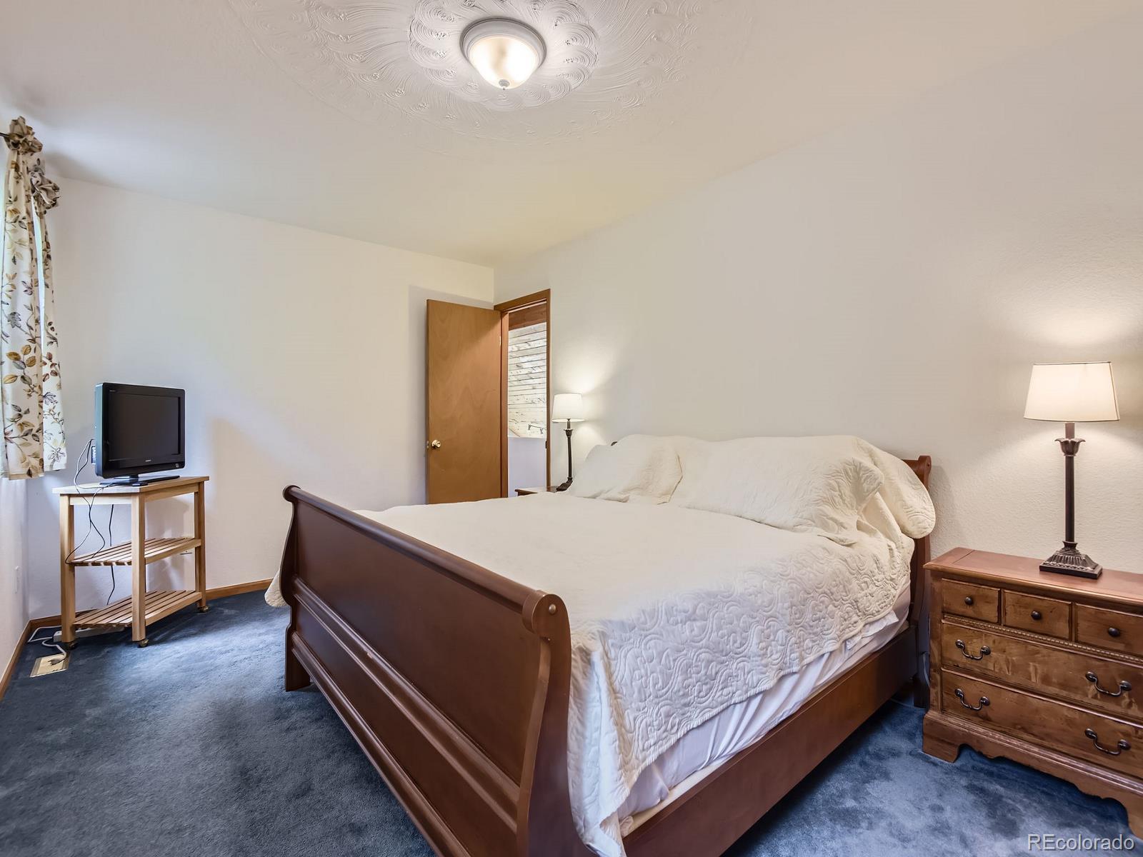 52 Branding Iron Lane Bailey, CO 80421 - Photo 18 of 29 a bed room with a bed and a television