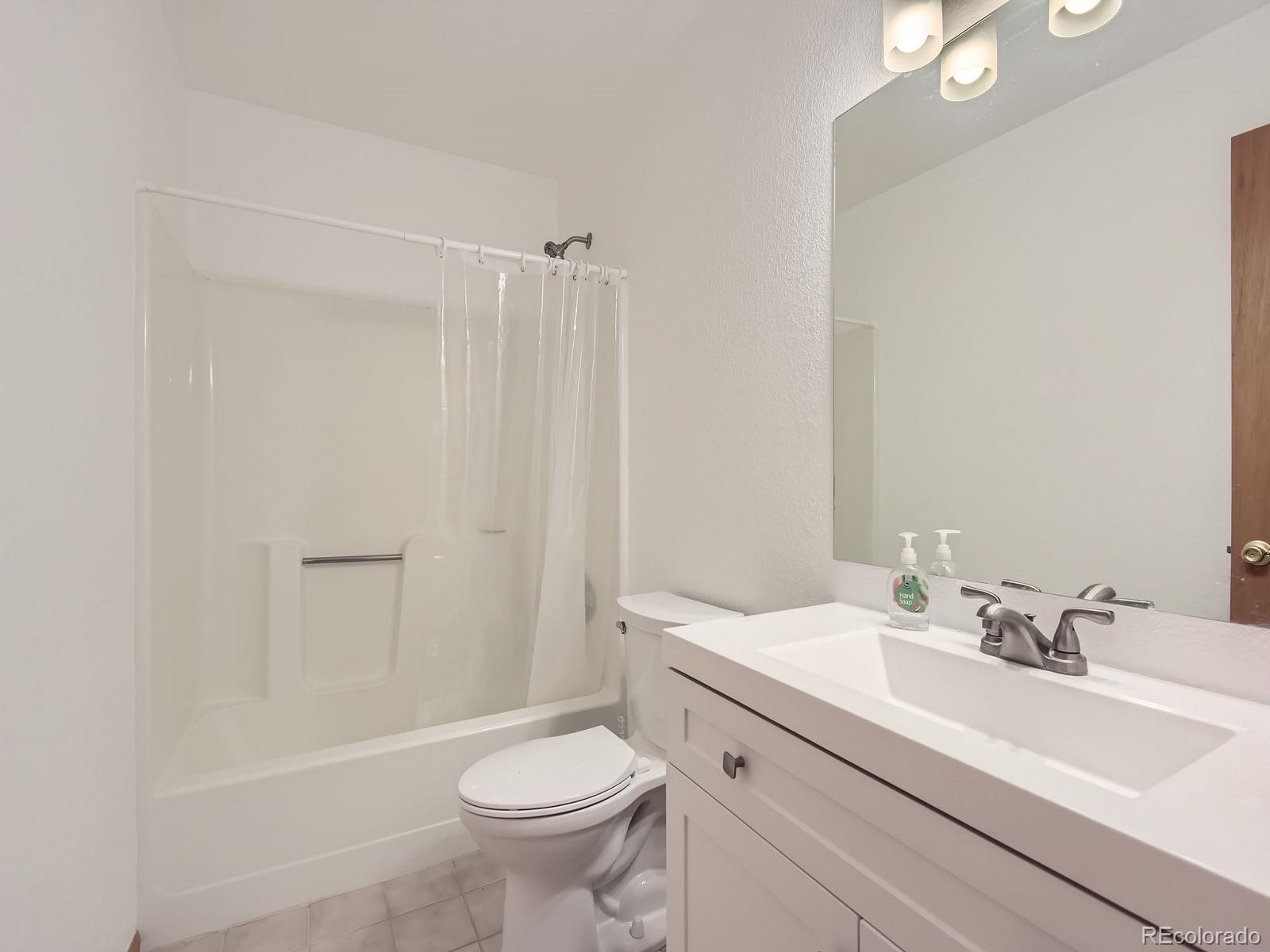 52 Branding Iron Lane Bailey, CO 80421 - Photo 22 of 29 a bathroom with a sink toilet and shower