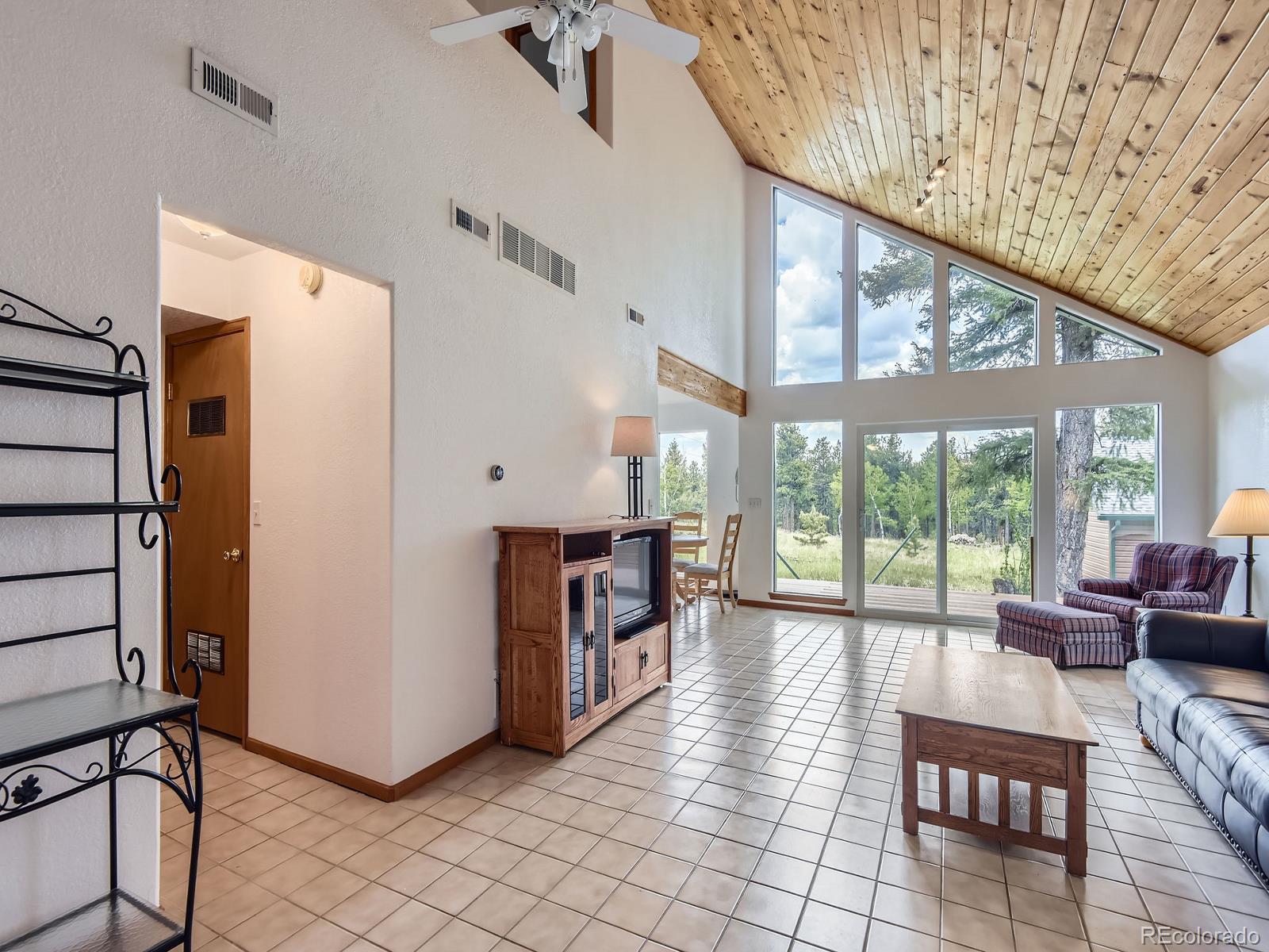 52 Branding Iron Lane Bailey, CO 80421 - Photo 5 of 29 a living room with furniture and a large window