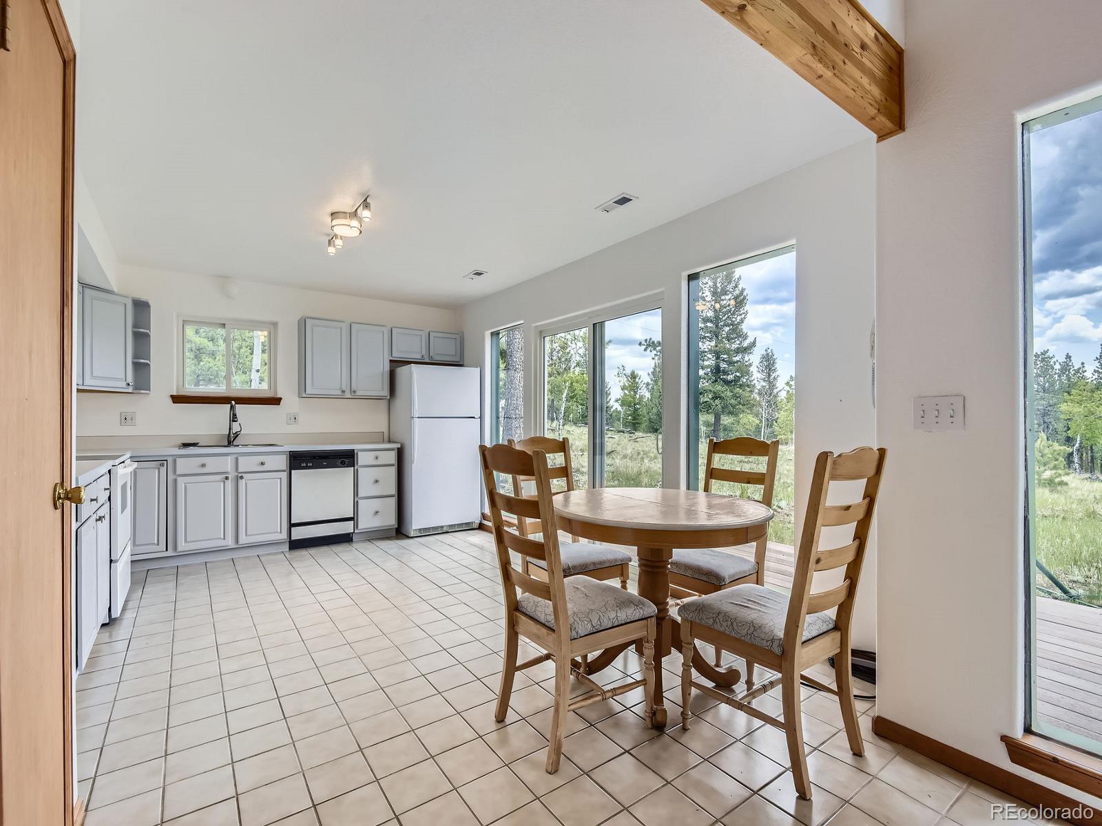52 Branding Iron Lane Bailey, CO 80421 - Photo 10 of 29 a dining room with furniture and kitchen view
