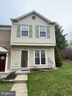 9646 Hingston Downs Columbia, MD 21046 - Photo 1 of 17 a front view of a house with a yard