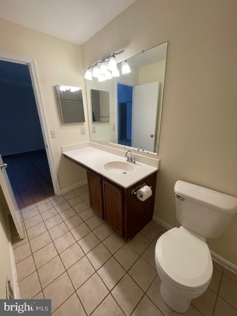 9646 Hingston Downs Columbia, MD 21046 - Photo 11 of 17 a bathroom with a toilet a sink and mirror