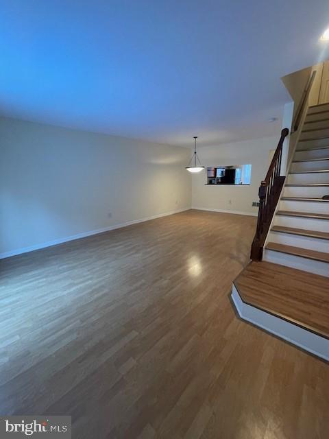 9646 Hingston Downs Columbia, MD 21046 - Photo 15 of 17 a view of entryway and hall with wooden floor