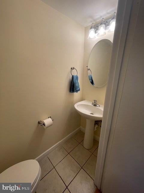 9646 Hingston Downs Columbia, MD 21046 - Photo 16 of 17 a bathroom with a sink toilet and a mirror