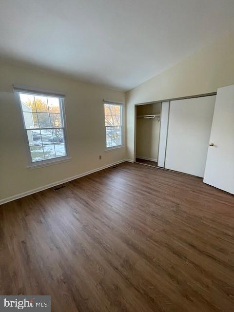 9646 Hingston Downs Columbia, MD 21046 - Photo 17 of 17 an empty room with wooden floor and windows