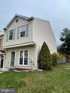 9646 Hingston Downs Columbia, MD 21046 - Photo 2 of 17 a front view of a house with a garden