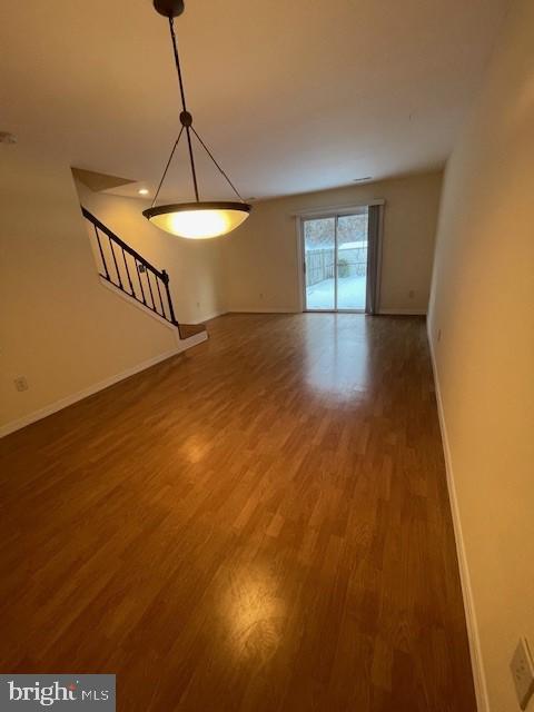 9646 Hingston Downs Columbia, MD 21046 - Photo 5 of 17 a view of empty room with wooden floor and fan