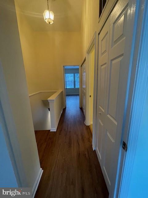 9646 Hingston Downs Columbia, MD 21046 - Photo 6 of 17 a view of a hallway with wooden floor and staircase