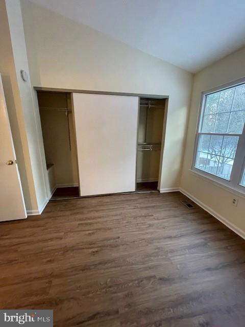 9646 Hingston Downs Columbia, MD 21046 - Photo 7 of 17 an empty room with wooden floor and windows