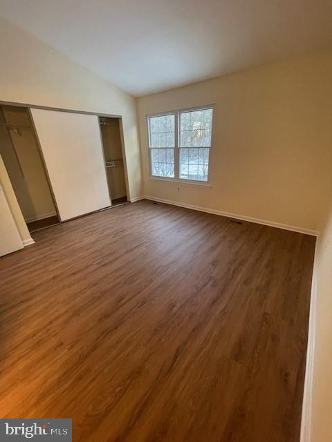 9646 Hingston Downs Columbia, MD 21046 - Photo 8 of 17 an empty room with wooden floor and windows