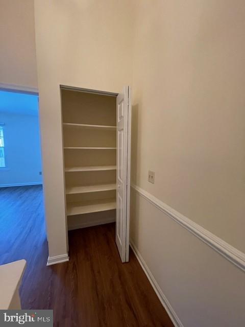 9646 Hingston Downs Columbia, MD 21046 - Photo 9 of 17 a view of walk in closet with wooden floor