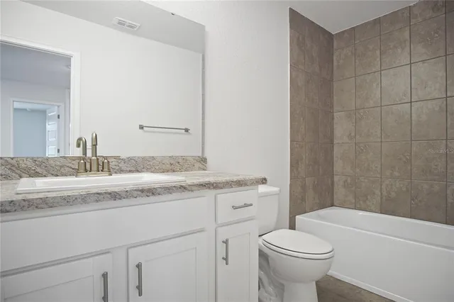 an empty room with closet area