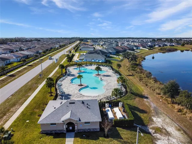 an aerial view of a house with a ocean view