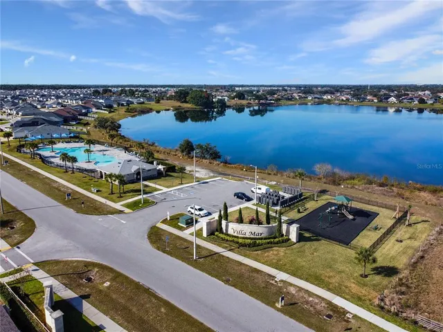 an aerial view of a house with a ocean view